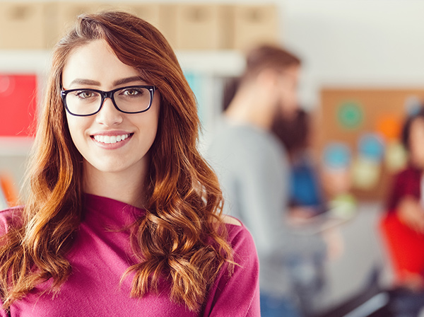 Young smiling lady with glasses